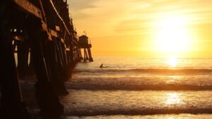 a person riding a surf board on a body of water